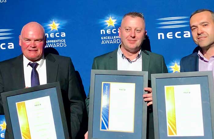 Three men holds NECA awards